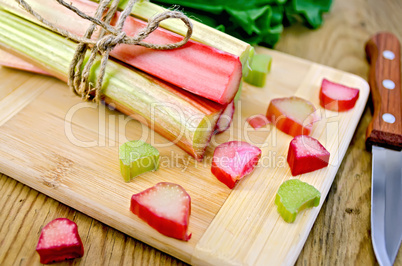 Rhubarb cut and knife on board