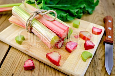 Rhubarb cut on board with knife