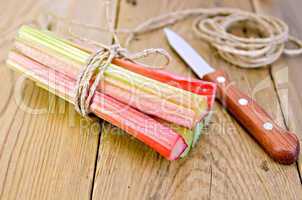 Rhubarb with coil of rope and knife on board