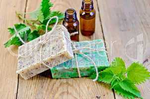 Soap homemade and oil with nettle on board