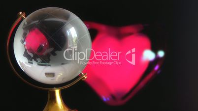 Globe on red beating heart