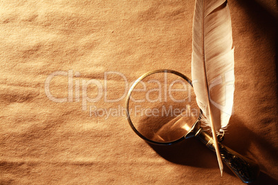 Magnifying Glass And Feather