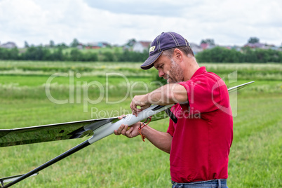 Man makes the assembly RC glider