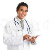 Southeast Asian medical doctor using tablet