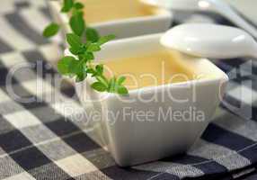 Cold vegetable soup in white bowl on table