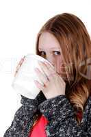 Girl drinking from big mug.