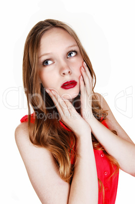 Girl holding her face.