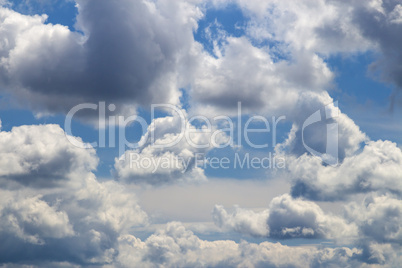 cirrus and cumulus clouds on blue sky