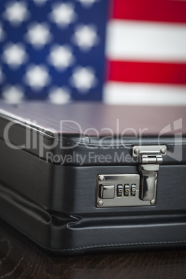 Leather Briefcase Resting on Table with American Flag Behind