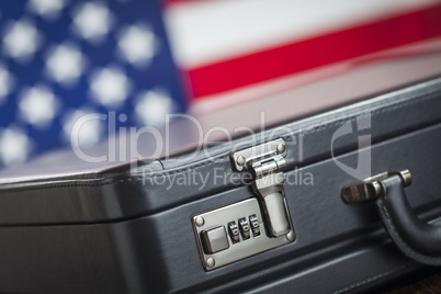 Leather Briefcase Resting on Table with American Flag Behind