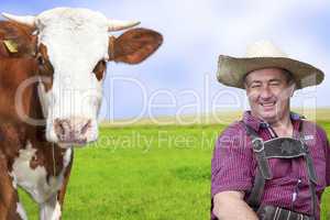 Portrait of farmer with his cow