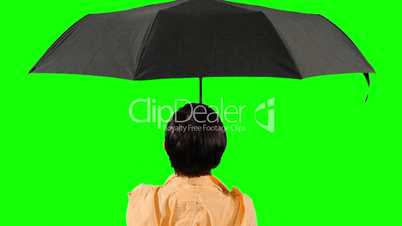 Close-up of a woman opens an umbrella. Green screen.