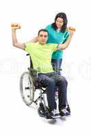 Therapist assists patient with weightlifting