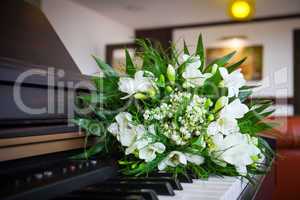 Wedding bouquet with fresia on a piano