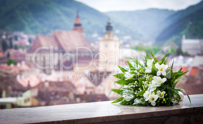 Wedding bouquet spring flowers with Brasov city view panoramic