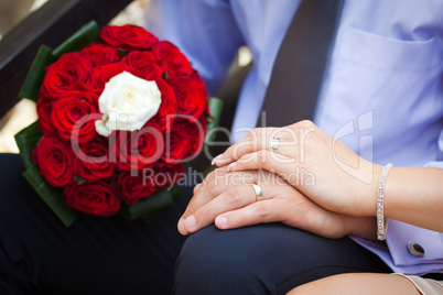 Bride and groom showing the engagement rings
