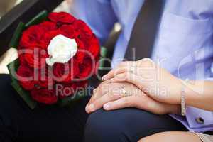 Bride and groom showing the engagement rings