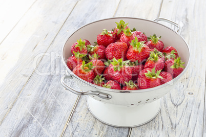 Strawberries in a sieve