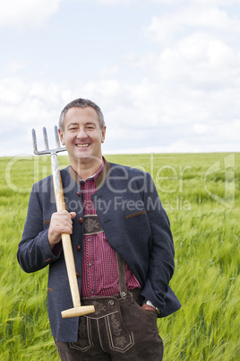 Farmer standing in his field