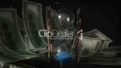 Money flying on background hourglass