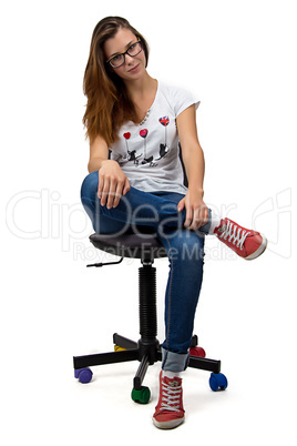 Teenager girl with glasses sitting on chair