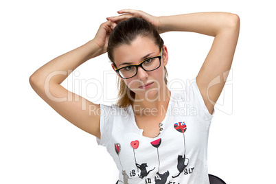 Teenager girl with glasses fixing her hair