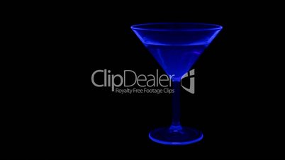 Coctail lit with UV light and green laser