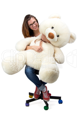 Sitting young teenager with teddy bear