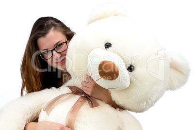 Happy young teenager with teddy bear