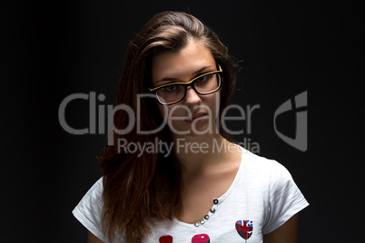 Portrait of teenager girl in shadow with glasses