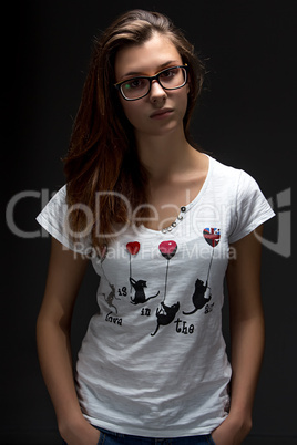 Serious teenager girl with glasses