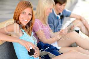 Student girl smiling friends in background