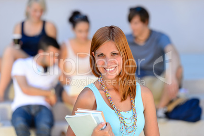 Summer college student girl smiling friends behind