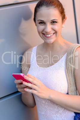 Smiling student girl with mobile phone