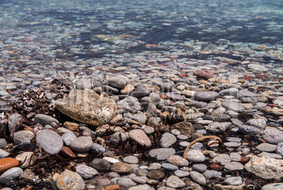 Rounded small rocks of a Greek Island beach