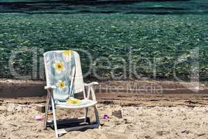 Beach chair with towel on a beautiful island. Relax abstract