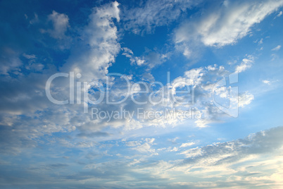 The white cumulus clouds against the blue sky