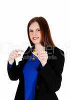 Woman holding vitamin pill.