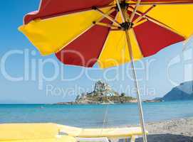 Beautiful beach umbrella with view on Kastri Island, Kos
