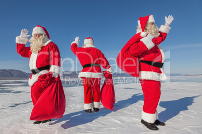 Three  Santa Claus outdoors