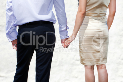 Young married couple holding hands