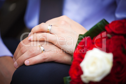 Bride and groom holding hands