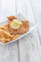 Schnitzel and French Fries on a Plate