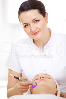 Cosmetician making lifting procedure