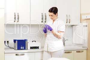 Cosmetician preapring tools for sterilization