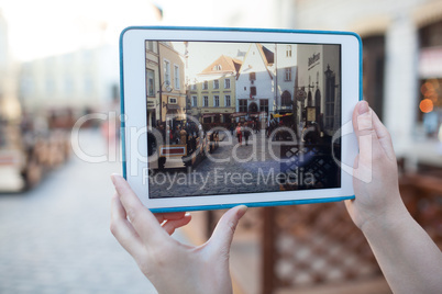 Making photo or video with pad of old street in Tallinn, Estonia
