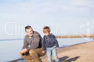 Father with his young son at the beach