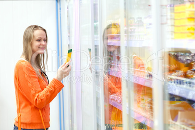 Woman taking product from the showcase