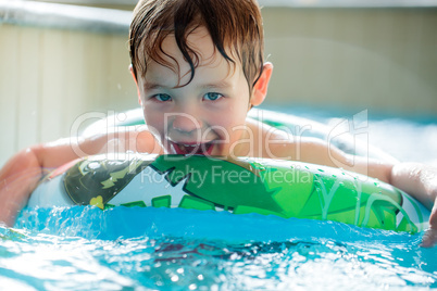 Boy in inflatable ring having fun
