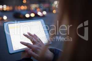 Woman touching tablet screen